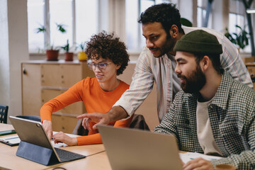 Diverse colleagues working on project in office