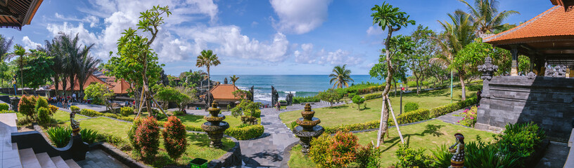 Scenic panoramic view of Tanah lot temple in Bali, Indonesia, showcasing lush gardens, ocean views, traditional Balinese architecture, and a serene atmosphere, 2020-01-05, Tanah Lot, Bali, Indonesia © Alexandre Patchine