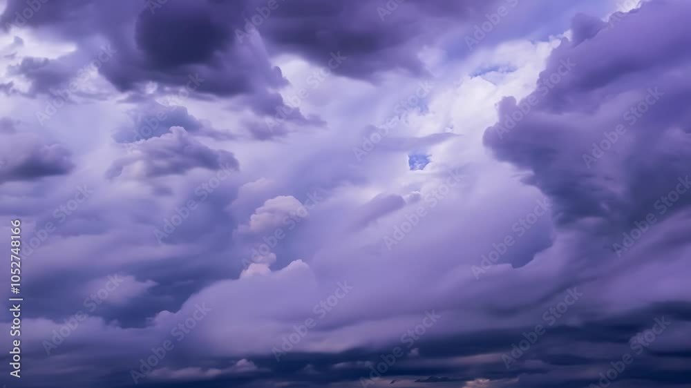Poster Gathering purple clouds morph into surreal shapes in the sky, creating an ominous atmosphere filled with dramatic beauty and vibrant colors during twilight