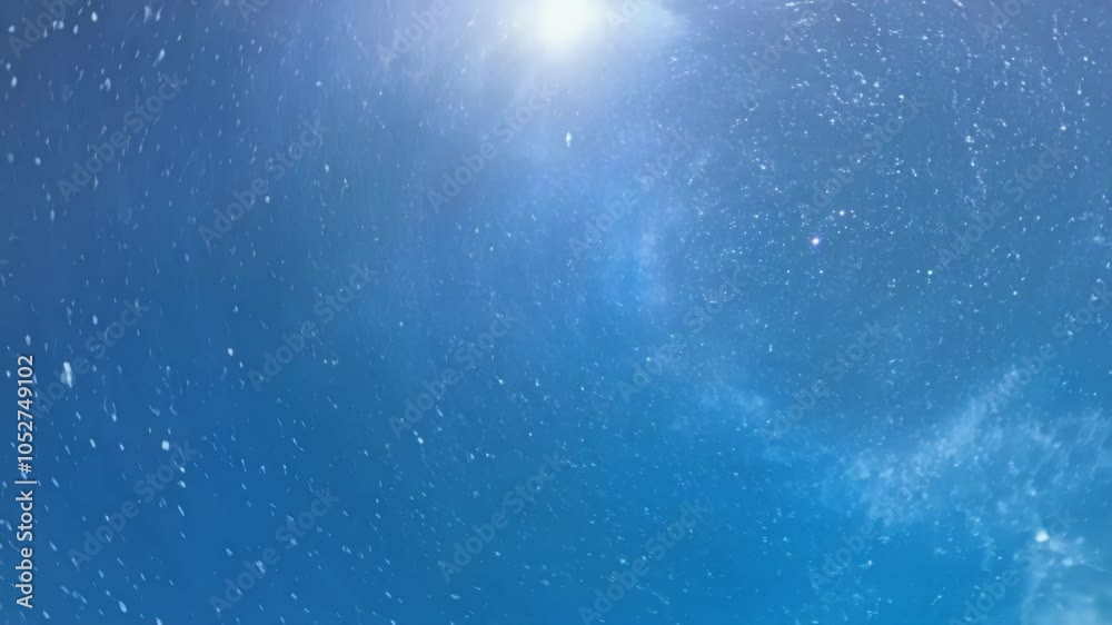 Poster camera is being pulled through a wormhole in space. blue and purple nebula clouds surround the camer
