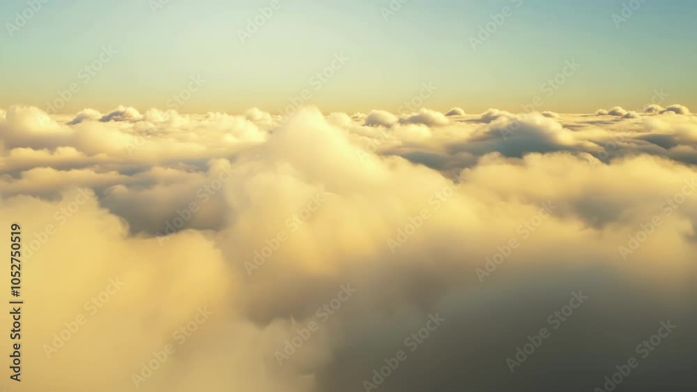 Poster Surreal cloudscape with golden light bathing fluffy clouds. The horizon stretches far, creating a sense of peace and wonder