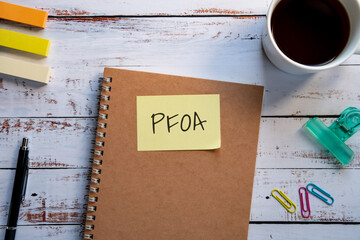 There is sticky note with the word PFOA. It is an abbreviation for Per Fluoro Octanoic Acid as...