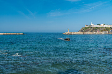 Fototapeta premium View from the beach of the chapel and the cemetery of the town of Luarca, Spain