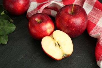 Fresh ripe red apples on grey textured table