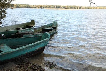 Obraz premium Many wooden boats on river. Water transportation