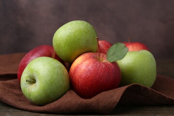 Many fresh ripe apples on table, closeup