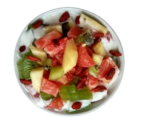 The fruit salad on a white plate