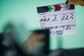 Assistant director with clapperboard on set. Close-up of firecrackers for filming a movie