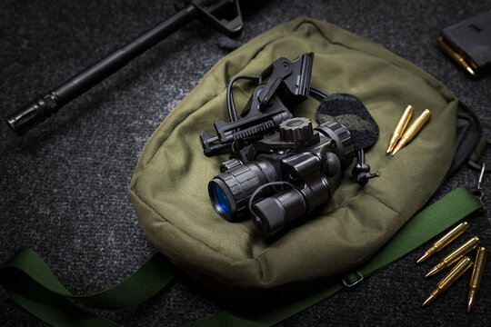 Military night vision monocular with helmet mount.