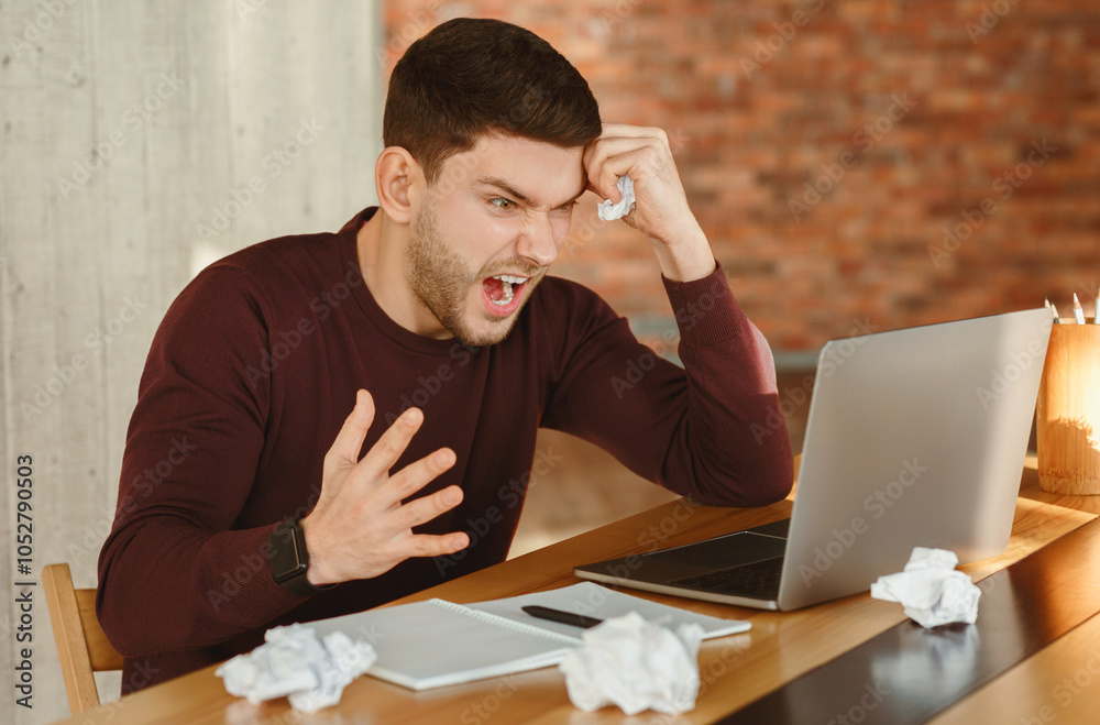 Poster workplace stress. angry businessman shouting crumpling paper sitting against laptop computer in mode