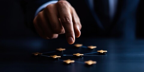 A focused hand engages with geometric shapes, symbolizing strategic planning and networking in a professional environment. This image captures the essence of connection and collaboration.