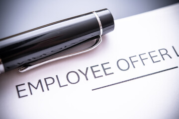 Close-up of an Employee Offer Letter and Pen, Signifying Job Acceptance and Career Opportunities in...