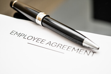 Professional Employee Agreement Document on a Desk with Elegant Black Pen for HR and Business Contracts