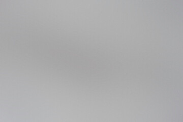 Abstract noisy grainy background featuring a smooth gradient transition and intriguing texture variations