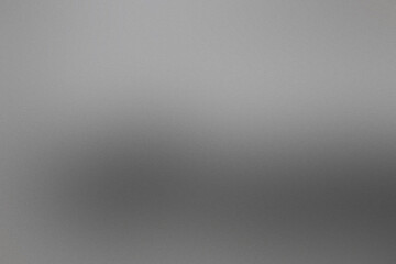 A blurry gray background with a few white dots. Noisy backdrop with grain