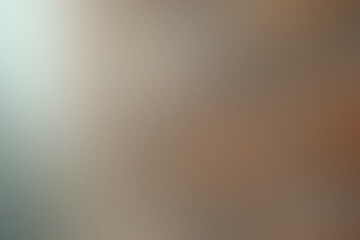 A blurry image of a brown background with a white line. Noisy backdrop with grain