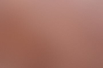 A brown background with a blurry image of a person. Noisy backdrop with grain