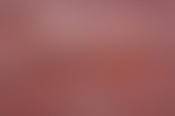 A red background with a blurry texture. Noisy backdrop with grain