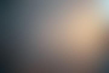 A blurry image of a wall with a light shining on it. Noisy backdrop with grain