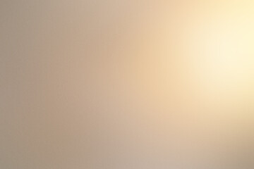 A blurry image of a wall with a sun shining through it. Noisy backdrop with grain