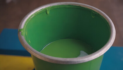 closeup of a bucket of green paint