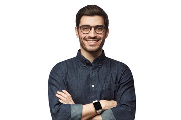 Smiling handsome man in blue denim shirt standing with crossed arms with smartwatch on wrist
