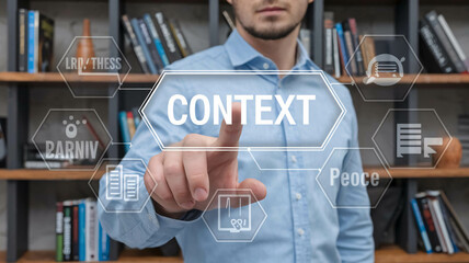 A man presses the following word on a virtual touch screen: CONTEXT. The concept of context in business education. Contextual analysis and education. 
