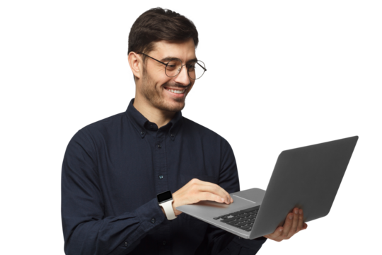 Portrait of young business man standing, holding laptop with happy smile