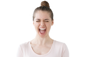 Expressive young woman screaming with eyes closed, showing a powerful emotional outburst
