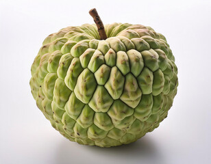 Obraz premium A large, green, heart-shaped fruit with a textured, scaly skin, photographed against a white background