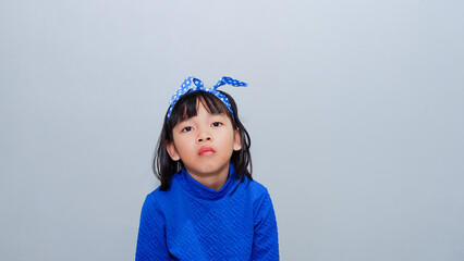 Beautiful kid girl standing over isolated grey background looking sleepy and tired, exhausted for...