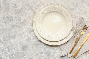 Beautiful table setting with gypsophila flowers on grey background
