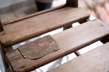 Sandpaper over wooden chair 