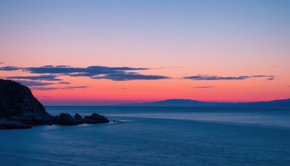 Naklejka premium a view of a sunset over the ocean with a lighthouse in the distance