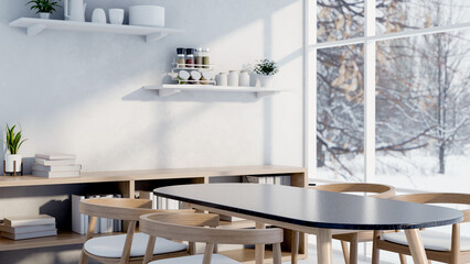 A minimalist white dining room featuring a simple dining table and a winter view outside.