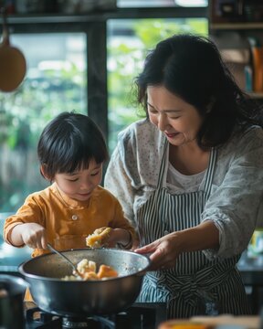 Mother and Child Cooking Together in Kitchen