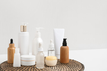 Set of various cosmetic products on light background