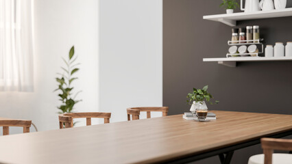 A close-up of a space for displaying products on a wooden dining table in a contemporary white room.