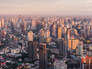 Bangkok aerial panoramic view from the Sukhumvit district at beautiful sunrise. A large asian capital city with skyscrapers and millions of inhabitants