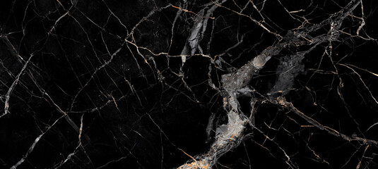 Elegant black marble surface with golden and white veins, perfect for backgrounds and luxury designs.