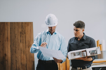 Team Engineers with draft plan of building on constructing site. Engineer work on site. engineer visit and inspection site engineer. Inspector engineer check and working on site.