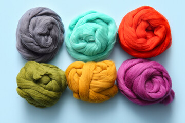 Set of different wool for felting on color background