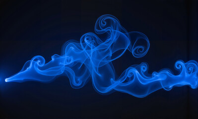 Obraz premium Blue swirling electric smoke on black background