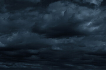 Obraz premium Stormy dark cloudy sky. Pollution, PM 2.5, Carbon dioxide and environment problems concept. Halloween, scary scene thunderstorm and rainy season backdrop.