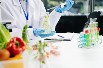 Food science as lab scientists test and analyze vegetables for safety and quality using advanced technology