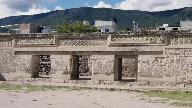 Slow motion landscape of temple wall monument at Mitla ruins palace archaeology museum zone in Oaxaca city Mexico Central America town village landmark tourism
