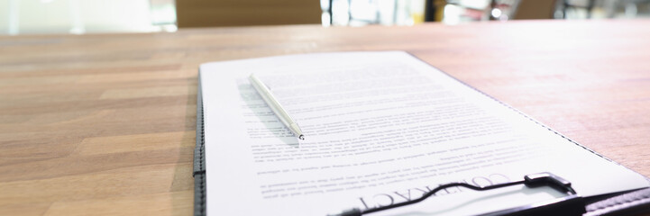 Fototapeta premium Contract documents and pen lie on table in business office