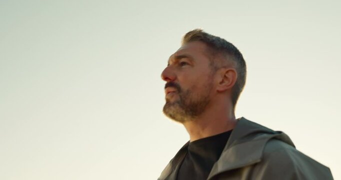 Man, tired and outdoor with fitness watch, tracking steps and proud of cardio activity on app. Male person, morning jog and check stats of workout, exhausted athlete and break for training info