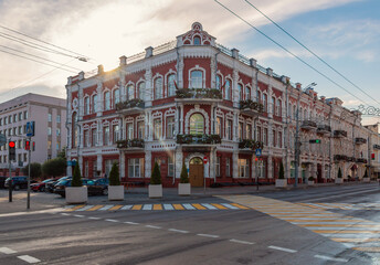 Red Art Nouveau apartment building built in 1894 on a quiet summer evening in Gomel, Belarus