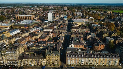 Aerial View of a Bustling Town with Historic and Modern Architecture